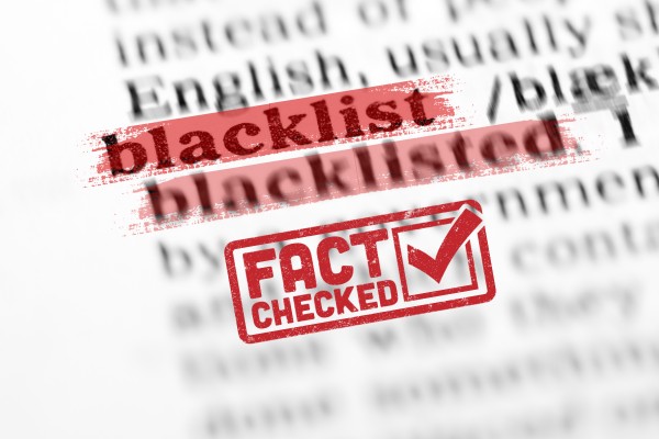 A section of a paragraph containing the words “blacklist” and “blacklisted” highlighted in red. A “fact checked” stamp under the two words.